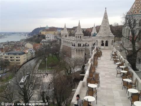 Café tables terrace along the neo-Romanesque towers of Fisherman's Bastion
