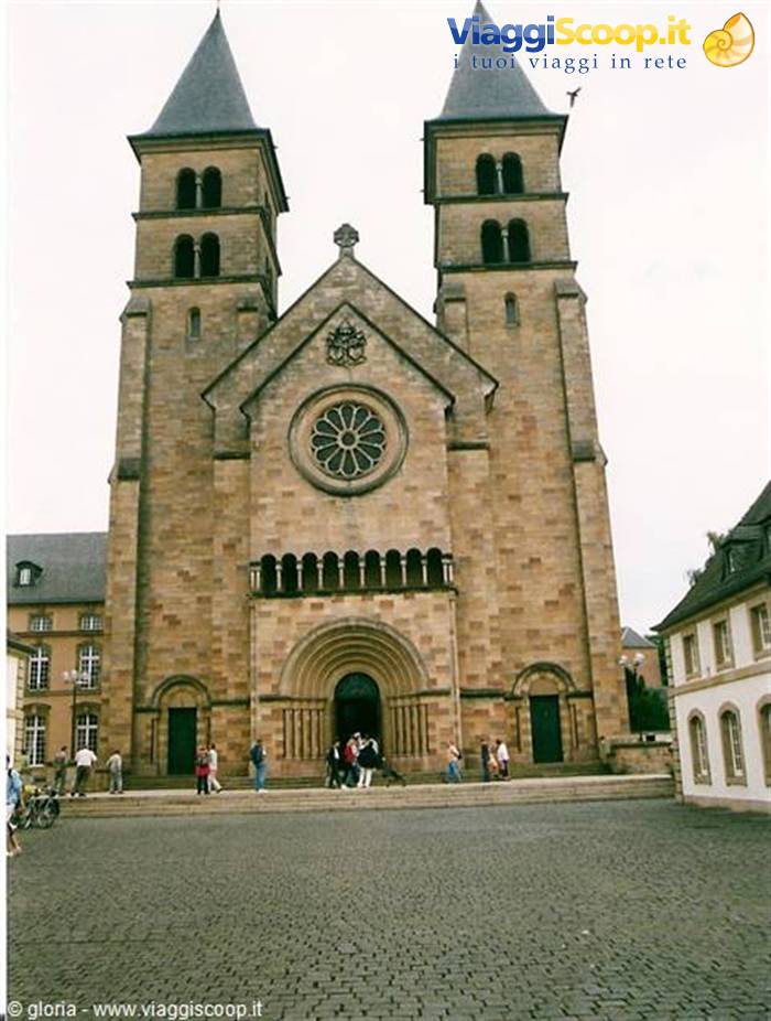 Echternach basilica: Romanesque stone facade with twin towers and rose window
