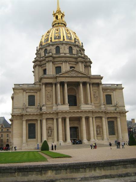 The golden dome of Les Invalides in Paris under grey sky, visitors strolling