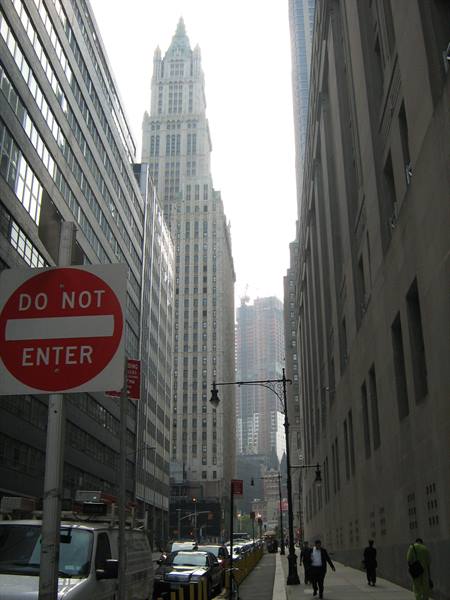 Do Not Enter sign among skyscrapers, Woolworth Building visible in distance