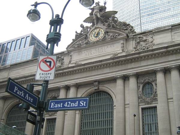 Park Ave and East 42nd St signs in front of Grand Central Terminal's stone facade