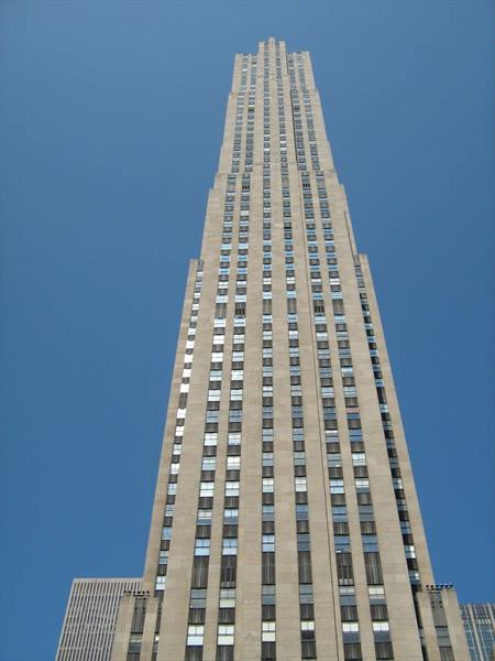 Limestone skyscraper rising against blue sky, Rockefeller Center, New York