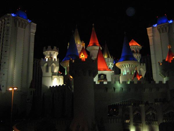 Excalibur hotel castle in Las Vegas lit at night with towers