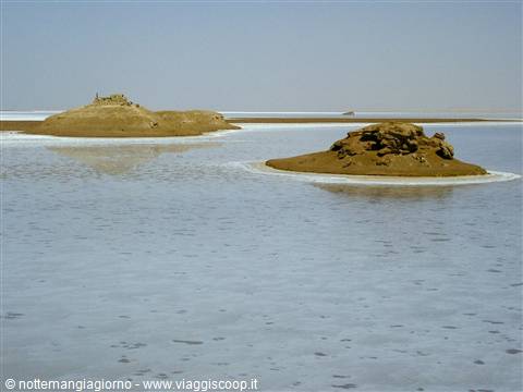 Earthen mounds rising from the salt waters of Lake Assal