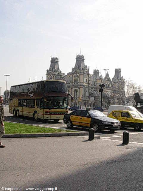 Yellow and black taxis and a coach in front of Estació de França, Barcelona