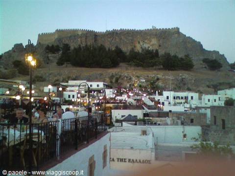 Acropolis of Lindos in the evening, dining above the rooftops