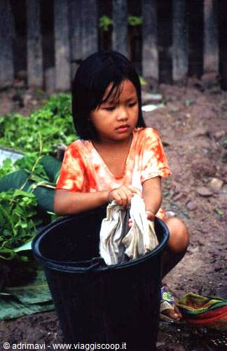 little girl washing clothes