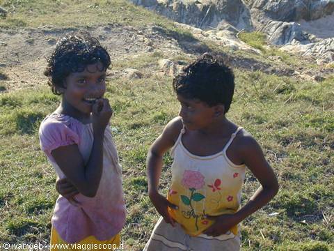 Children curious about the tourists. They speak Italian from the few tourists who reach Dickwella