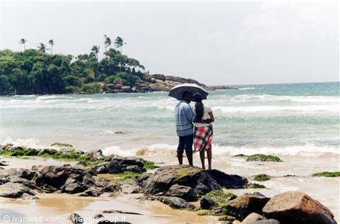 A young couple on a romantic walk on the beach
