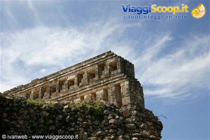 Mayan stone ruins at Uxmal under blue sky with clouds