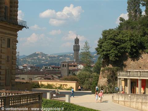 Visitors walking through Boboli Gardens, Palazzo Vecchio tower rising behind