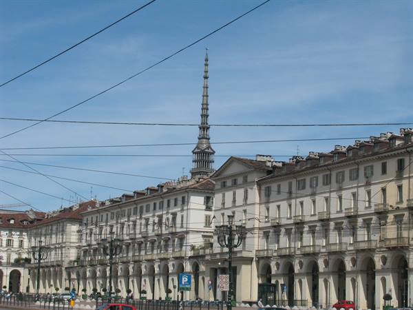 The Mole Antonelliana towering above Piazza Vittorio Veneto in Turin, tram wires overhead