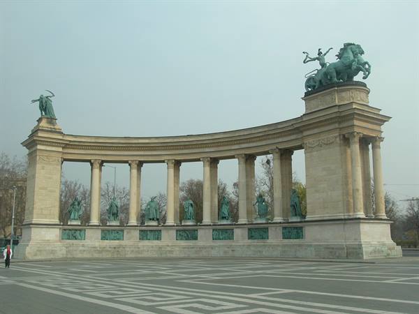 Stone colonnade with bronze statues at Budapest Heroes' Square