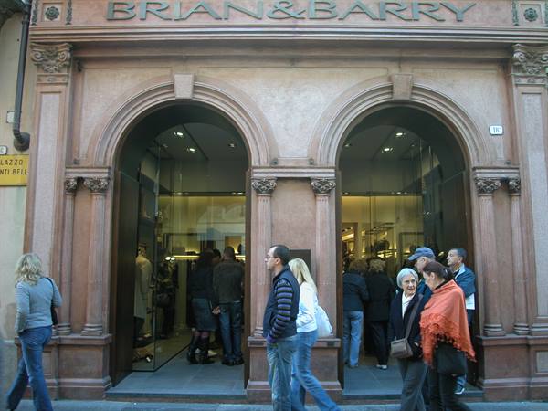 People beneath the pink stone arches of the Brian & Barry entrance
