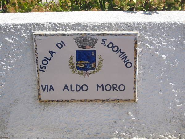 Ceramic plaque with coat of arms on white wall, Isola di San Domino