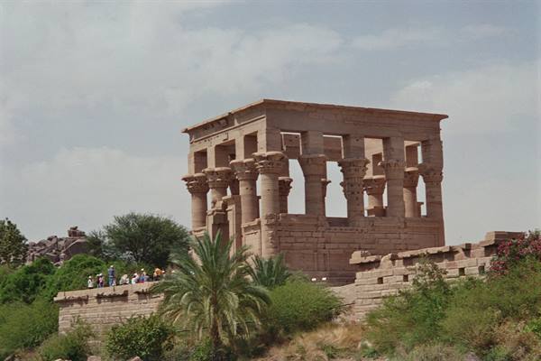 Tourists on the wall in front of the Kiosk of Trajan at Philae
