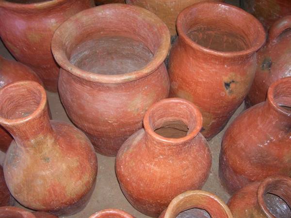 Handmade red clay amphorae under natural light