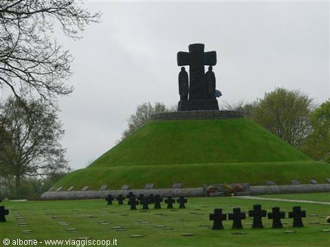 La Cambe German war cemetery, grassy mound with black cross and stone crosses