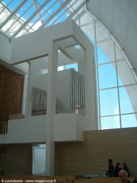 Pipe organ on white structure inside the Dives in Misericordia church, Rome