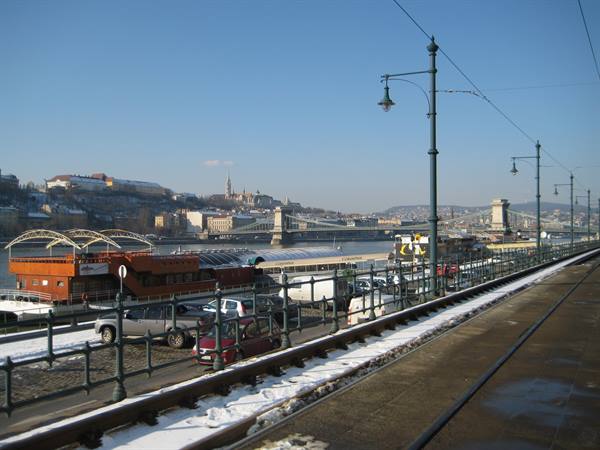 Snowy tram tracks along the Danube, Chain Bridge in Budapest