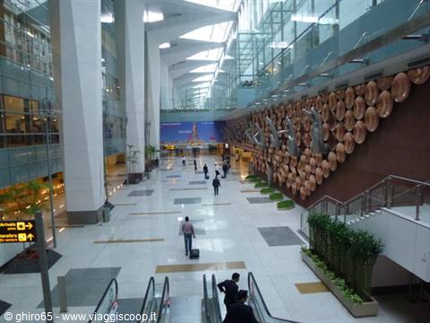 Indira Gandhi Airport, Delhi, corridor with golden mudra hands wall