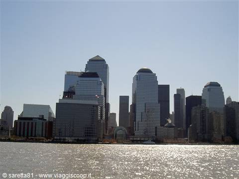 Manhattan glass skyscrapers reflecting sunlight above the Hudson River