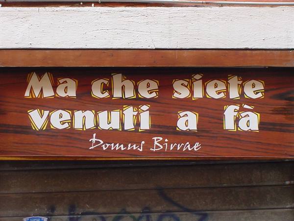 Wooden sign with yellow lettering Ma che siete venuti a fà, Domus Birrae
