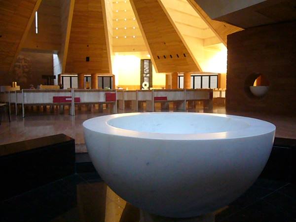 White marble baptismal font inside Padre Pio church in San Giovanni Rotondo
