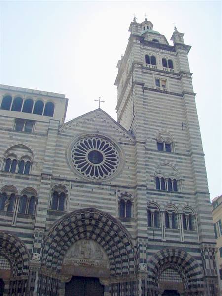 Black and white striped facade of Genoa's San Lorenzo cathedral with Gothic rose window