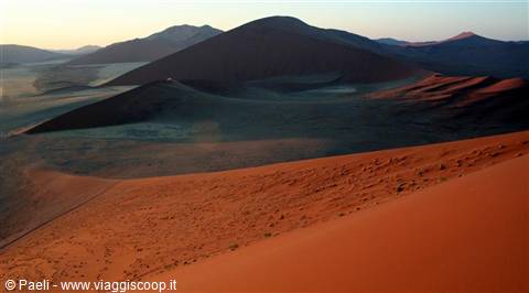 Red sand dunes at Sossusvlei under soft morning light