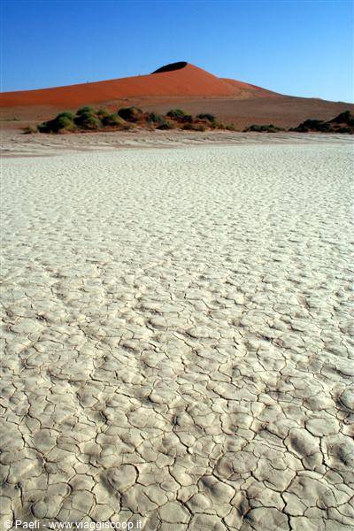 White cracked clay and red dune under blue sky, Sossusvlei