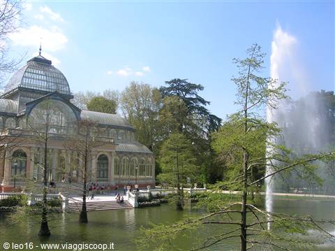 Palacio de Cristal in Retiro Park, glass and iron greenhouse by the pond