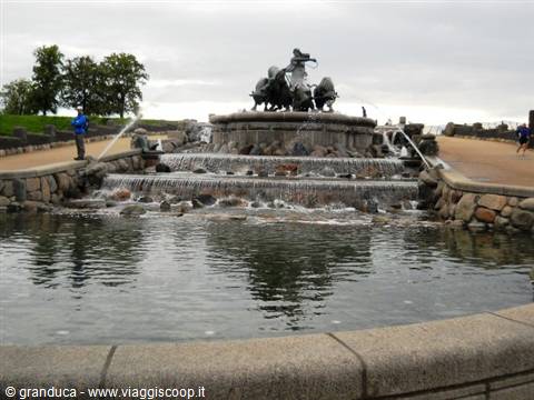 Gefion Fountain in Copenhagen, water cascading over rocks near the grove