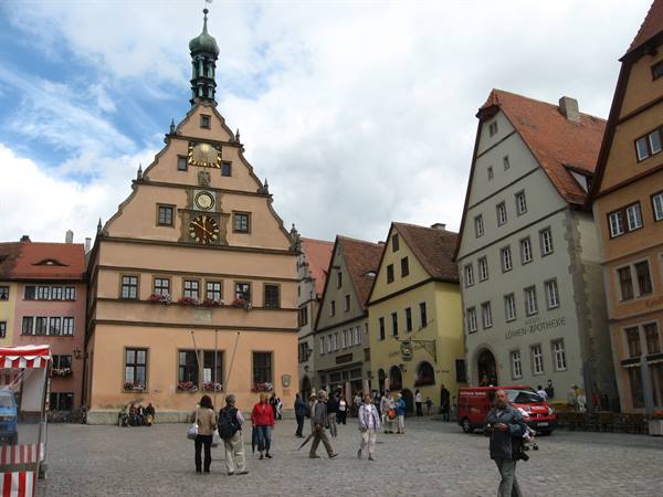 Tourists walking on the square in front of Rothenburg ob der Tauber town hall