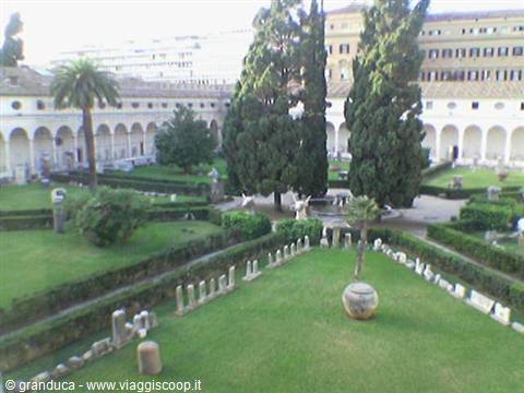 Cloister of the Baths of Diocletian in Rome, garden with cypresses and Roman ruins