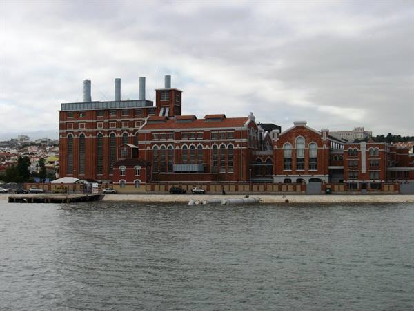 Red-brick power station with four chimneys along the Tagus in Lisbon