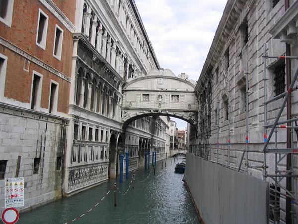 Bridge of Sighs in Venice, white stone bridge connecting two palaces over a canal