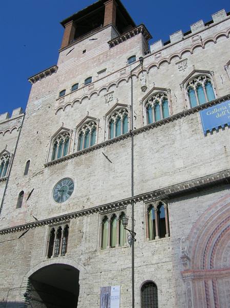 Palazzo dei Priori in Perugia, stone facade with Gothic windows, clock and tower