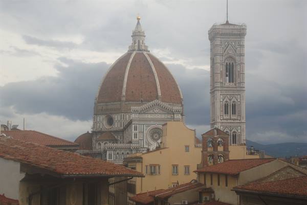 Florence Cathedral with Brunelleschi's dome and Giotto's bell tower above rooftops