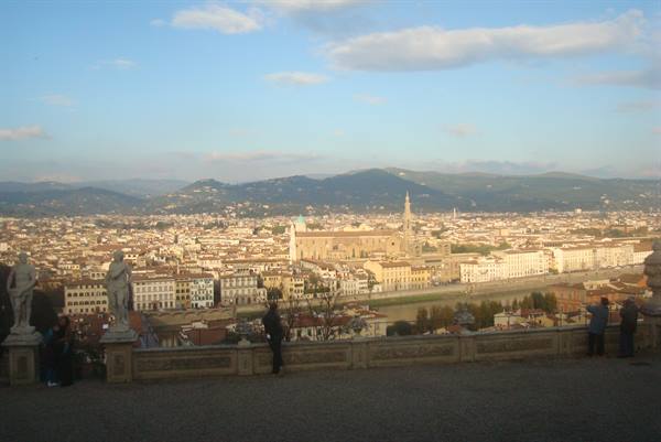 Piazzale Michelangelo: marble statues on terrace, tourists overlooking Florence and Santa Croce