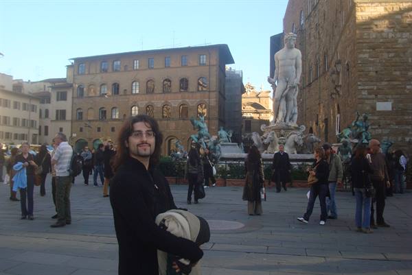 Tourist in Piazza della Signoria with the Neptune Fountain in Florence