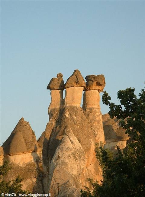Fairy chimneys in Cappadocia, tuff rock pillars lit by evening sun