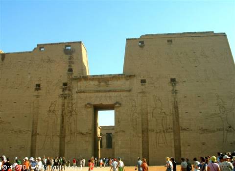 Tourists in front of the sandstone pylon at Edfu Temple