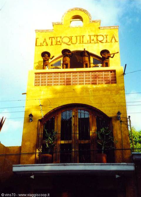Yellow facade of La Tequileria with mariachi statues in Piedras Negras