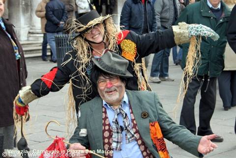 Two scarecrow costumes in straw at St Mark's Square carnival, Venice