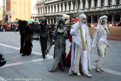 Costumed masks at Venice Carnival in St Mark's Square