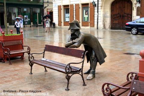 Bronze statue of Napoleonic soldier leaning on a bench, Bratislava
