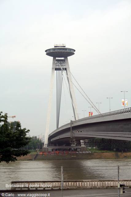 Bratislava SNP Bridge, pylon with UFO disc restaurant over Danube, gray sky
