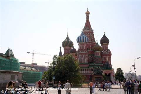 Tourists walking on Red Square in front of Saint Basil's Cathedral in Moscow