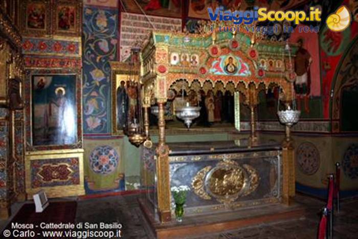 St Basil's Cathedral, Moscow: gilded tomb under ornate canopy, among colorful frescoes